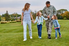 Happy family with soldier father walking outdoor. royalty free stock photos Happy family with soldier father walking outdoor. royalty free stock photos