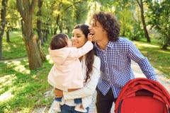 Happy family standing playing in the park. royalty free stock images Happy family standing playing in the park. royalty free stock images