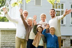 Happy family waving hands in front of house stock photography Happy family waving hands in front of house stock photography