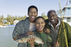 Happy Family With Fishing Rod And Fish Stock Photography Happy Family With Fishing Rod And Fish Stock Photography