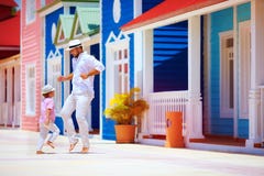 Happy father and son enjoy life, dancing on caribbean street royalty free stock photos Happy father and son enjoy life, dancing on caribbean street royalty free stock photos