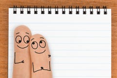 Happy Finger Face Couple with Blank Notepad Copy Space stock images Happy Finger Face Couple with Blank Notepad Copy Space stock images