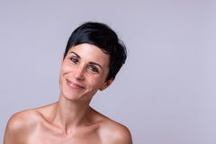 Happy friendly young woman with bare shoulders stock photo Happy friendly young woman with bare shoulders stock photo