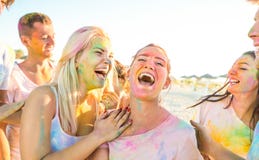 Happy friends group having fun at beach party on holi festival royalty free stock photos Happy friends group having fun at beach party on holi festival royalty free stock photos