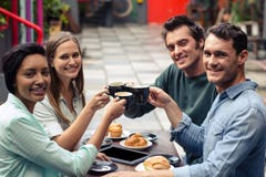 Happy friends having coffee together royalty free stock image Happy friends having coffee together royalty free stock image