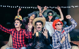 Happy friends having fun with costumes in a party royalty free stock photos Happy friends having fun with costumes in a party royalty free stock photos