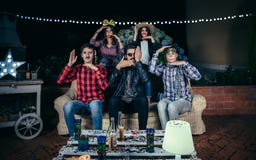 Happy friends having fun with costumes in party stock photos Happy friends having fun with costumes in party stock photos