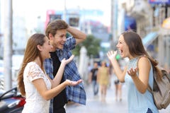 Happy friends meeting in the street stock image Happy friends meeting in the street stock image