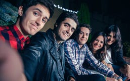 Happy friends smiling and taking selfie in party stock images Happy friends smiling and taking selfie in party stock images