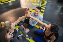 Happy friends are spending active time in gym Royalty Free Stock Images Happy friends are spending active time in gym Royalty Free Stock Images