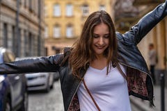 Happy Girl Is Dancing In The Old City. Street Fashion Photo Shoot With Beautiful Female Model Royalty Free Stock Images