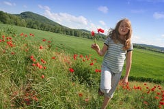 Happy Girl On Poppies Field Stock Photo