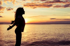 Image result for a woman standing on the beach