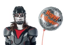 Happy halloween. hockey player in a hockey helmet and mask with a balloon against isolated backdrop or background. All Saints` Da stock photography Happy halloween. hockey player in a hockey helmet and mask with a balloon against isolated backdrop or background. All Saints` Da stock photography