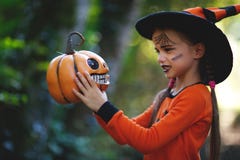 Happy Halloween! horrible creepy child girl in pumpkin costume Stock Photography Happy Halloween! horrible creepy child girl in pumpkin costume Stock Photography