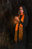Happy Halloween! A pretty witch with a big pumpkin. Beautiful yo royalty free stock photo Happy Halloween! A pretty witch with a big pumpkin. Beautiful yo royalty free stock photo