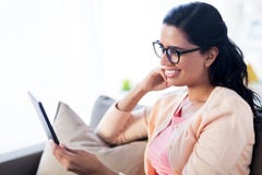 Happy indian woman with tablet pc at home stock images Happy indian woman with tablet pc at home stock images