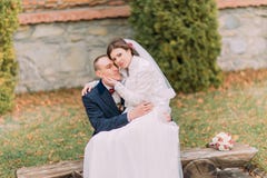 https://thumbs.dreamstime.com/t/happy-just-married-couple-autumn-park-elegant-bride-sitting-knees-her-handsome-new-husband-75957613.jpg