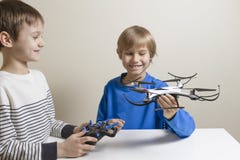 Happy kids with drone at home. Technology, education, leisure, toys concept stock photos Happy kids with drone at home. Technology, education, leisure, toys concept stock photos