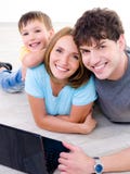 Happy Laughing Family With Laptop Royalty Free Stock Photography Happy Laughing Family With Laptop Royalty Free Stock Photography