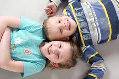Happy Laughing Kids On The Floor Royalty Free Stock Photos
