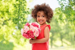 Happy little african american girl with flowers stock photos Happy little african american girl with flowers stock photos