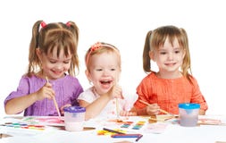 Happy little girl in kindergarten draw paints on white background Royalty Free Stock Photo Happy little girl in kindergarten draw paints on white background Royalty Free Stock Photo