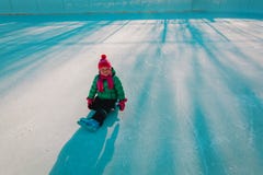 Happy cute ittle girl skating in winter royalty free stock photography Happy cute ittle girl skating in winter royalty free stock photography
