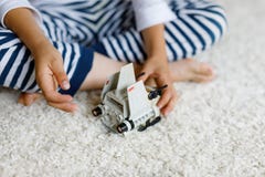 Happy little kid boy playing with space shuttle toy. Cute child in having fun in the morning before school. Closeup stock photography Happy little kid boy playing with space shuttle toy. Cute child in having fun in the morning before school. Closeup stock photography