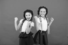 Happy little sisters. Beauty. small kid fashion. Childhood happiness. Friendship and sisterhood. childrens day. Back to royalty free stock image Happy little sisters. Beauty. small kid fashion. Childhood happiness. Friendship and sisterhood. childrens day. Back to royalty free stock image