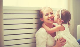 Happy loving family. mother and child playing, kissing and hugg stock photo Happy loving family. mother and child playing, kissing and hugg stock photo