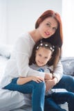 Happy loving family. Mother and her daughter child girl playing and hugging royalty free stock photography Happy loving family. Mother and her daughter child girl playing and hugging royalty free stock photography