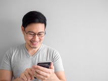 Happy man is using smartphone. Concept of using social media on royalty free stock photo Happy man is using smartphone. Concept of using social media on royalty free stock photo
