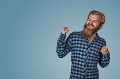 Happy man winning, fists pumped celebrating success stock photo Happy man winning, fists pumped celebrating success stock photo