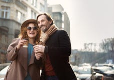 Happy man and woman enjoying coffee on street royalty free stock images Happy man and woman enjoying coffee on street royalty free stock images