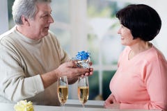 A happy mature couple celebrating their years together with red stock image A happy mature couple celebrating their years together with red stock image