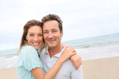 Happy middle-aged couple on the beach royalty free stock photos Happy middle-aged couple on the beach royalty free stock photos