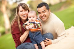 Happy Mixed Race Family Posing For A Portrait Stock Image