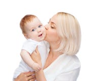 Happy mother kissing smiling baby royalty free stock photography Happy mother kissing smiling baby royalty free stock photography