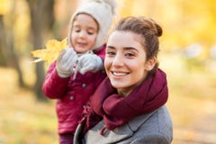 Happy mother with little daughter at autumn park Stock Image Happy mother with little daughter at autumn park Stock Image