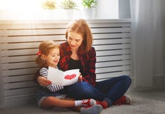 Happy mother`s day! Daughter gives her mother an postcard Stock Photo Happy mother`s day! Daughter gives her mother an postcard Stock Photo