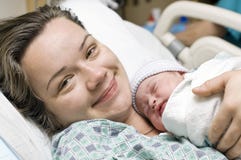 Happy Mother With Newborn Baby Stock Images