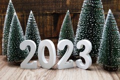 Happy New Year 2023 Festive Background With Christmas Tree And Pine Cone Decoration On Wooden Background Royalty Free Stock Images