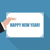 Happy New Year. Hand with sheet of paper with long shadow stock illustration Happy New Year. Hand with sheet of paper with long shadow stock illustration
