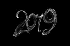 Happy new year 2019 isolated numbers lettering written with fire flame or smoke on black background. vector illustration Happy new year 2019 isolated numbers lettering written with fire flame or smoke on black background. vector illustration