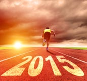 Happy new year 2015. young man running with sunrise stock images Happy new year 2015. young man running with sunrise stock images