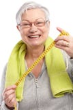Happy old lady with tape measure Stock Images Happy old lady with tape measure Stock Images