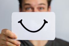 Happy Portrait of Someone Holding a Smiling Mood Board stock photo Happy Portrait of Someone Holding a Smiling Mood Board stock photo