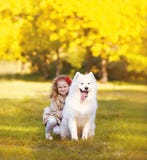 Happy positive child and dog having fun outdoors stock images Happy positive child and dog having fun outdoors stock images