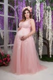 Happy Pregnant Woman In Pink Long Dress Royalty Free Stock Photography